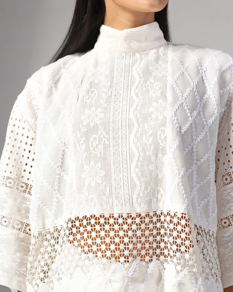 Ivory embroidered lace top with scalloped hem and textured high-waist shorts