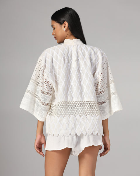 Ivory embroidered lace top with scalloped hem and textured high-waist shorts