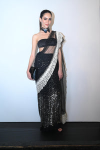 Modern sequined saree with sheer drape and sculpted bandeau blouse.