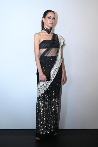 Modern sequined saree with sheer drape and sculpted bandeau blouse.