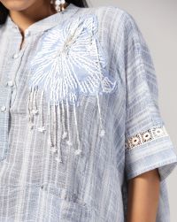 Self-check very soft linen woven tunic with herbal hand embroidery in cotton thread, worn with anti-fit poplin salwar."