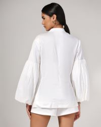 white stretch cotton with crushed bubble  sleeves and a badge jacket…