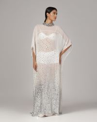 White gepgette with granded silver sequins spray all over and a heavy beaded collar, long slip can be provided