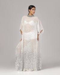 White gepgette with granded silver sequins spray all over and a heavy beaded collar, long slip can be provided